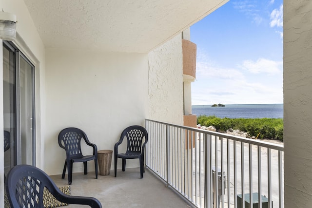 balcony featuring a water view