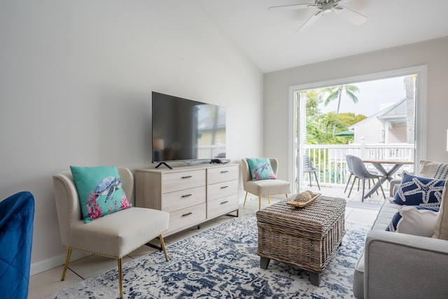 living room with ceiling fan and lofted ceiling