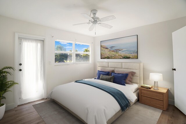 bedroom featuring ceiling fan and light hardwood / wood-style flooring