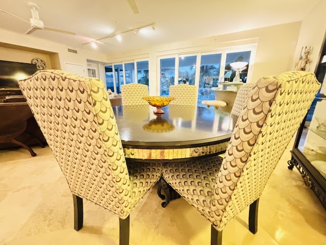 dining area with visible vents and rail lighting