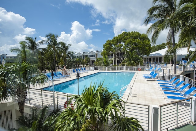 pool featuring a patio and fence