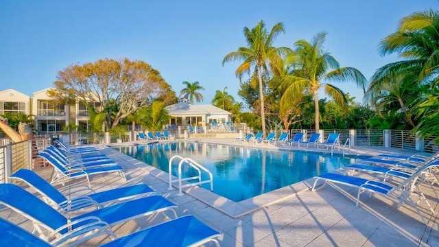 pool featuring a patio and fence