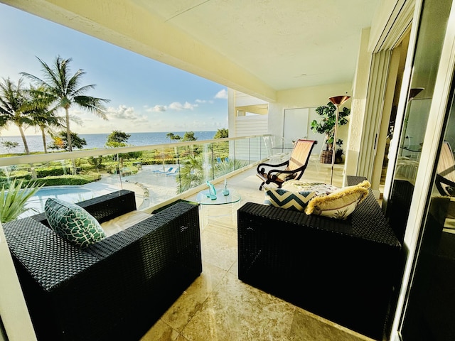 balcony featuring a water view