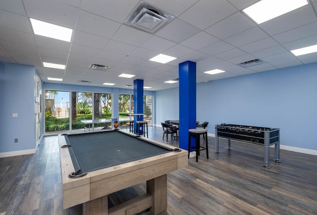 game room with visible vents, baseboards, and dark wood finished floors