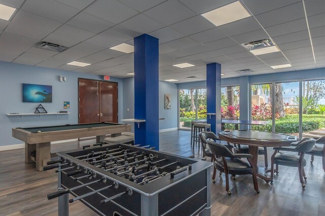 game room featuring visible vents, baseboards, and wood finished floors