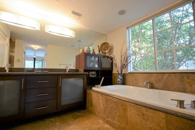 full bath with a garden tub and double vanity