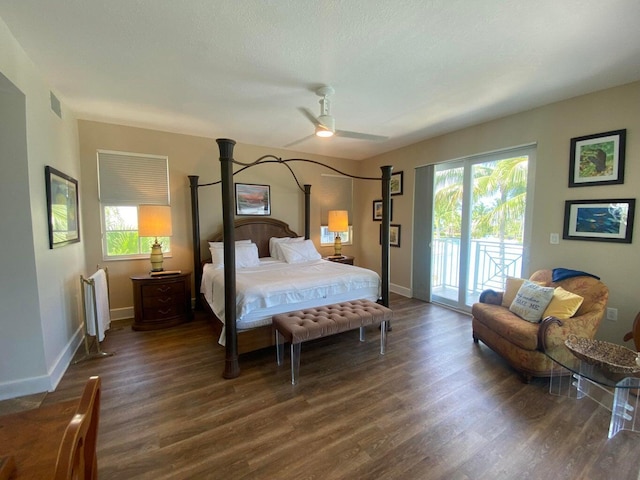 bedroom with visible vents, radiator, baseboards, dark wood-style floors, and access to outside