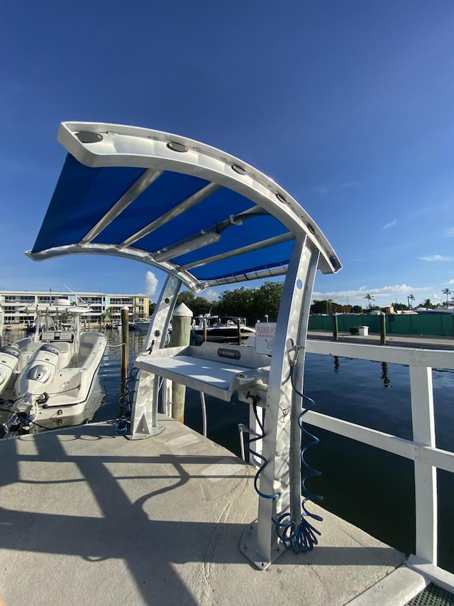 view of parking / parking lot featuring a boat dock