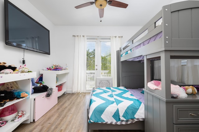 107 Hilson Ct, Tavernier, FL 33070 - bedroom featuring access to outside, light wood-type flooring, and a ceiling fan