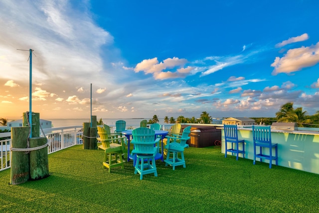 107 Hilson Ct, Tavernier, FL 33070 - yard at dusk featuring a water view and a yard