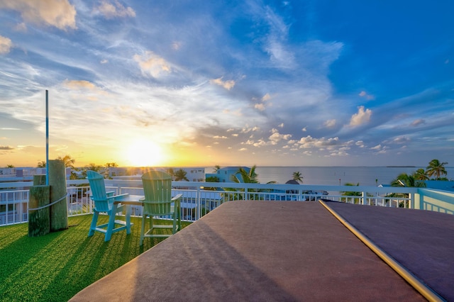 107 Hilson Ct, Tavernier, FL 33070 - patio terrace at dusk featuring a water view
