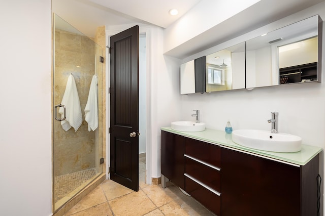 107 Hilson Ct, Tavernier, FL 33070 - full bath with a stall shower, double vanity, stone tile floors, a closet, and recessed lighting