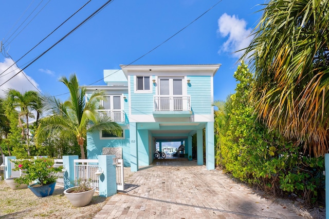 107 Hilson Ct, Tavernier, FL 33070 - beach home with a carport and decorative driveway