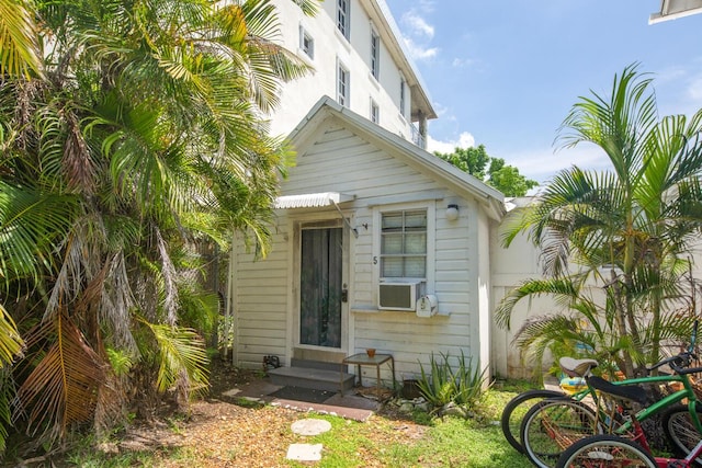 901 Eisenhower Dr, Key West, FL 33040 - doorway to property featuring cooling unit and stucco siding