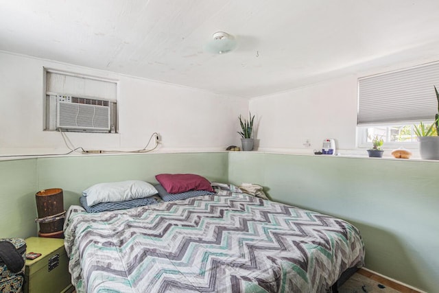 bedroom featuring a wall mounted air conditioner