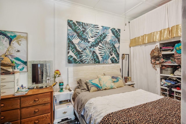 bedroom with ornamental molding