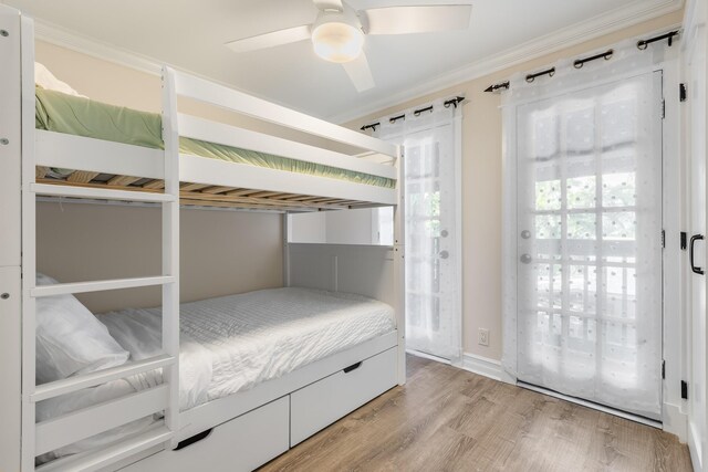 unfurnished bedroom featuring crown molding, ceiling fan, and light wood-type flooring