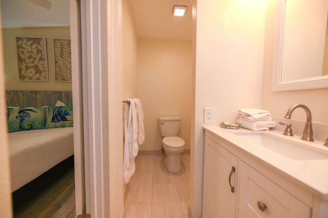 156 Marine Ave, Tavernier, FL 33070 - ensuite bathroom with vanity, ensuite bathroom, toilet, and wood finished floors