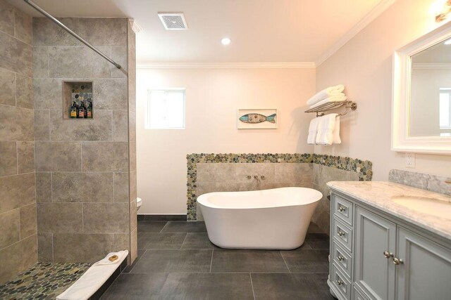 156 Marine Ave, Tavernier, FL 33070 - bathroom with visible vents, a freestanding tub, ornamental molding, a tile shower, and vanity