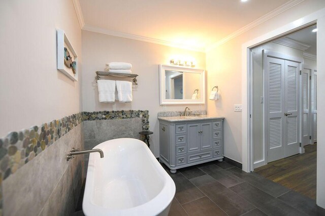 156 Marine Ave, Tavernier, FL 33070 - full bath with crown molding, a soaking tub, wood finished floors, and vanity