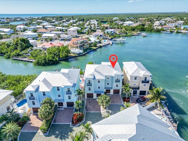 aerial view featuring a residential view and a water view