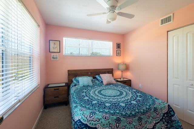 bedroom featuring visible vents, a closet, ceiling fan, and carpet floors