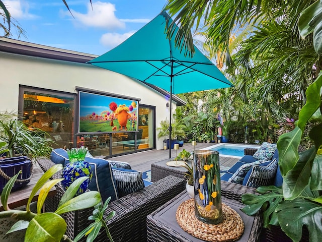 view of patio with outdoor lounge area and a swimming pool side deck