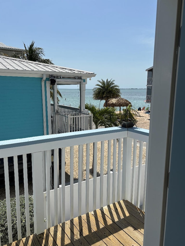 wooden deck featuring a water view