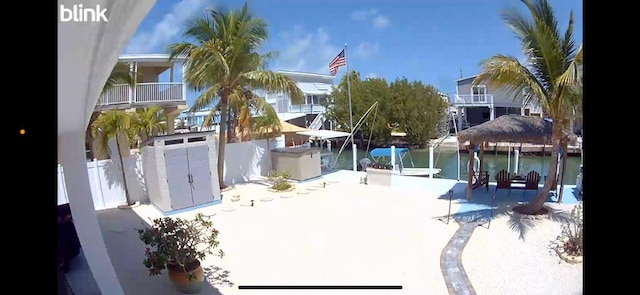 exterior space with boat lift and a boat dock