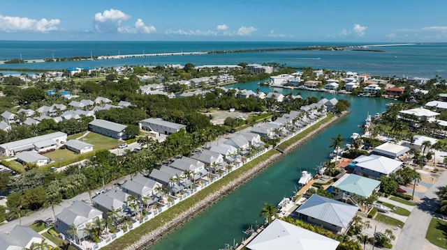 bird's eye view with a water view and a residential view