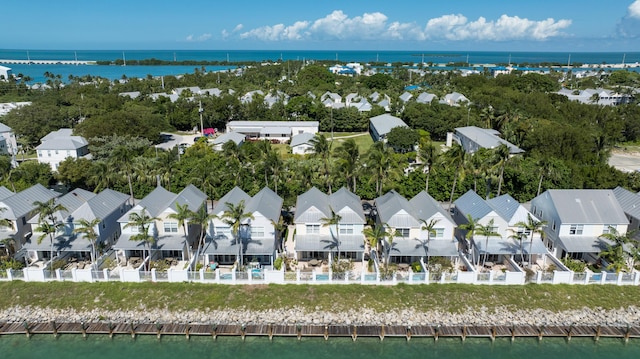 bird's eye view featuring a residential view and a water view