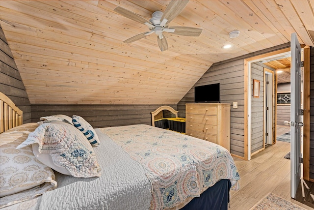 bedroom with lofted ceiling, wood walls, wooden ceiling, light wood-type flooring, and ceiling fan