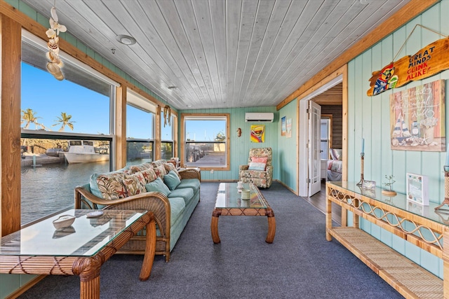 sunroom / solarium with wood ceiling, an AC wall unit, and a water view