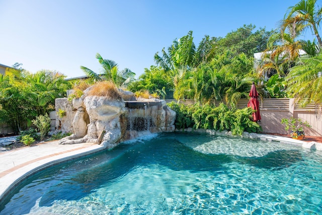 view of pool featuring pool water feature