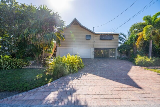 view of side of property featuring a garage