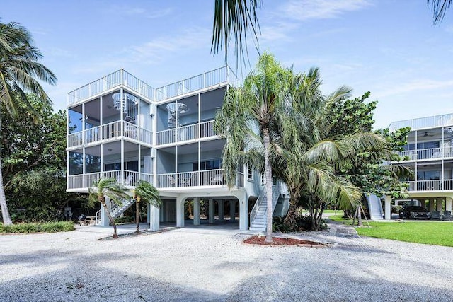 140 Aregood Ln Unit C2, Islamorada, FL 33036 - view of apartment building / complex with stairway, a carport, and driveway