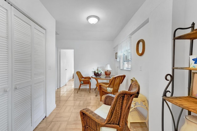 sitting room with light tile patterned floors