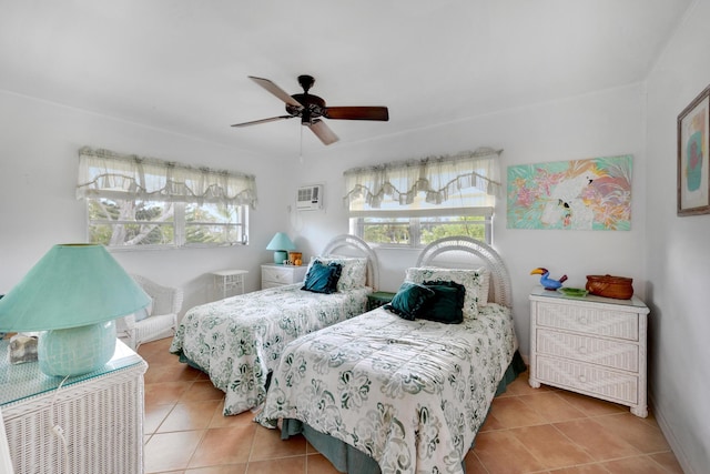 tiled bedroom with a wall unit AC and ceiling fan