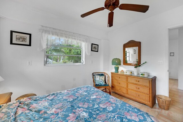 tiled bedroom with ceiling fan