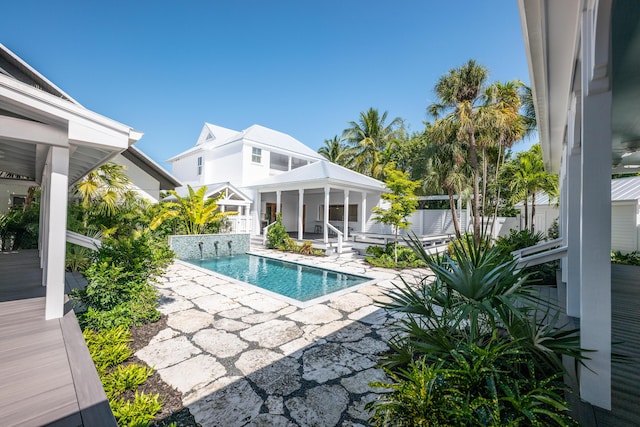 view of swimming pool featuring a fenced in pool and a patio area