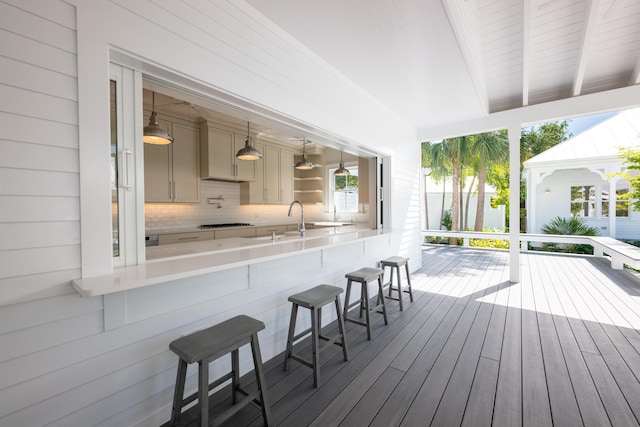 wooden terrace featuring a sink