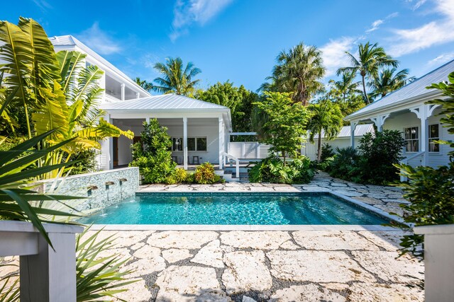 pool with a patio area