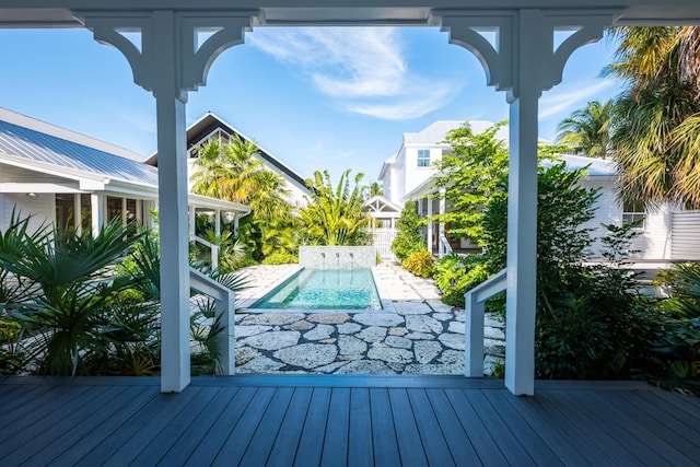 wooden deck featuring an outdoor pool