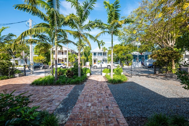 view of property's community featuring a gate and fence