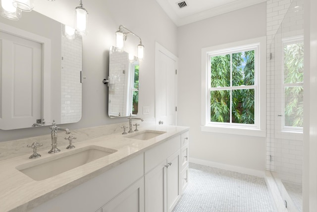 full bathroom featuring crown molding, visible vents, a sink, and double vanity