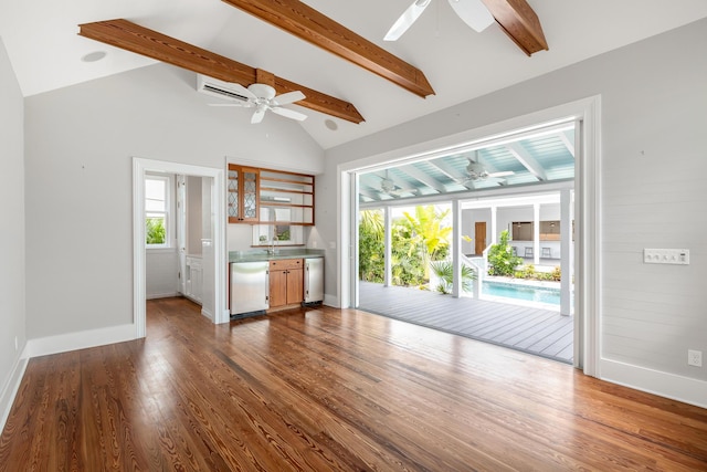 unfurnished living room with baseboards, ceiling fan, dark wood-type flooring, vaulted ceiling with beams, and a sink