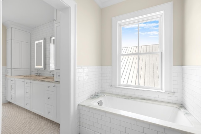 full bath with tile walls, a bath, and vanity