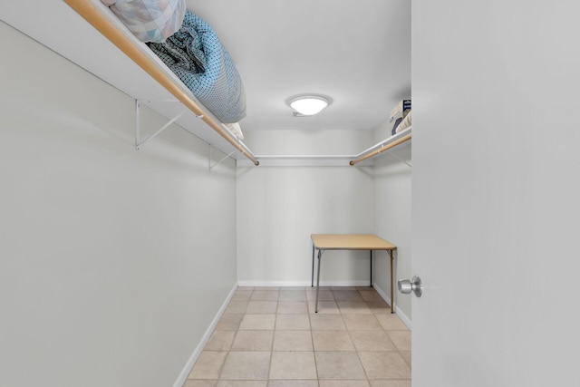 spacious closet with light tile patterned flooring