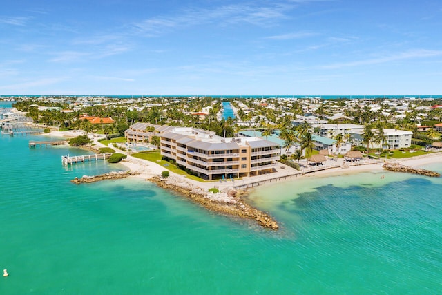 drone / aerial view featuring a view of the beach and a water view