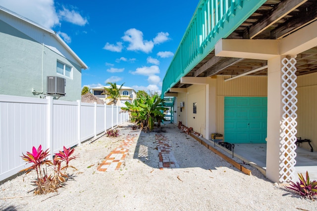 exterior space with a garage and fence